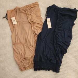 Two Anthropologie sleeveless cropped faux wrap ruffle shirts.  Size Large
